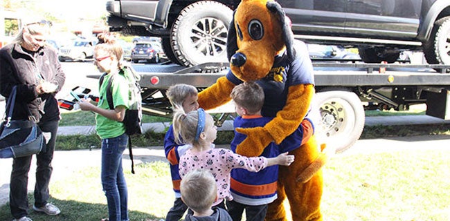 Dog mascot with kids